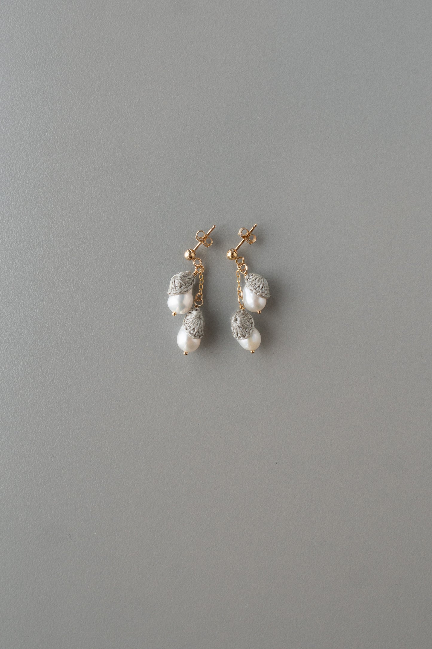 Nestling drop pearl earrings | Silver gray